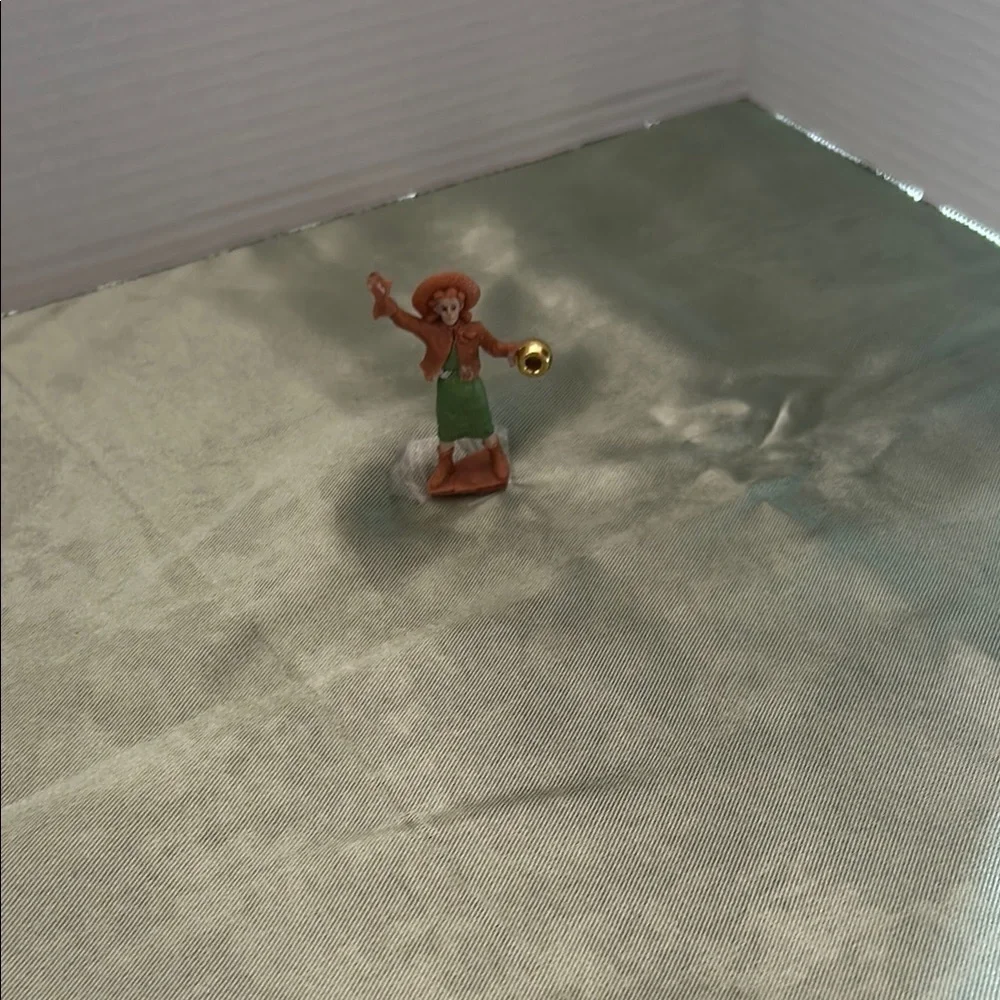 Charming Figurine with Green and Brown Attire